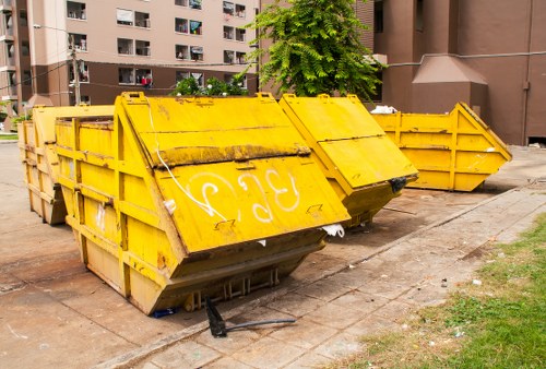 Company representative reviewing a complaint form for skip hire services