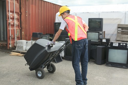 Professional skip hire team assisting with domestic waste